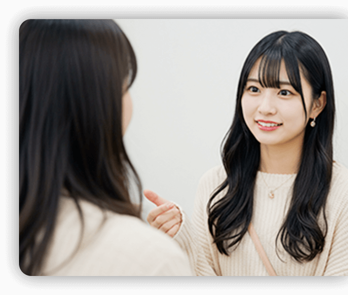 担当と話す女性の写真